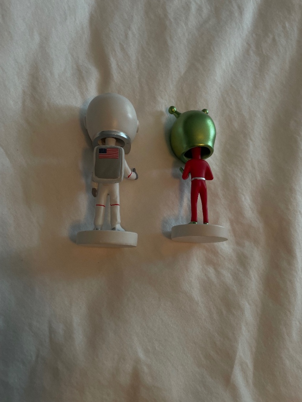 Both Alien Figurine and Astronaut Figurine bobbleheads